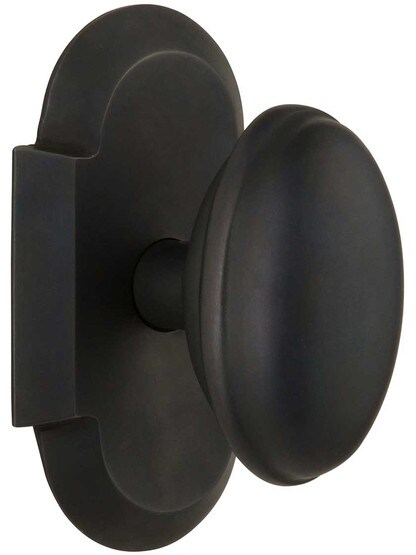 Arched Rosette Door Set with Homestead Knobs in Oil-Rubbed Bronze.
